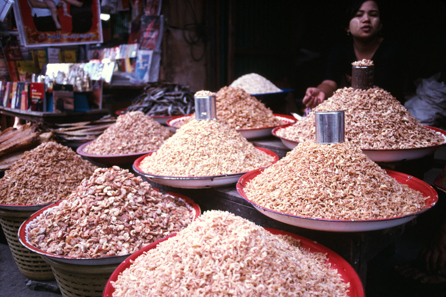 2010: Dried shrimp in different qualities for sale in the Burmese market. A common ingredient in many Asian cuisines, used by Burmese to add flavor to vegetable curries and salads.