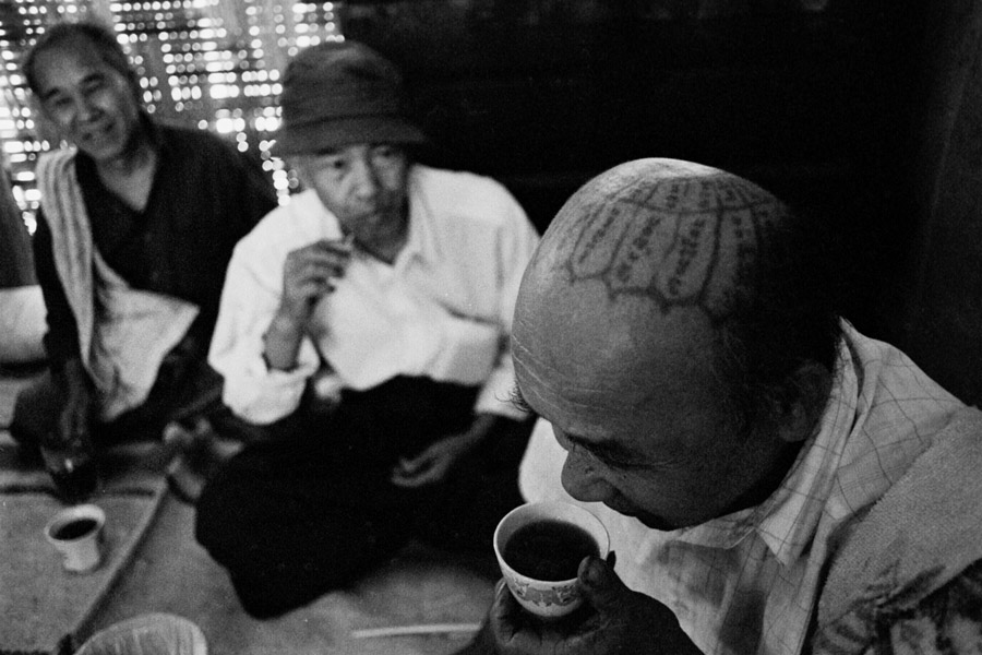 Ko Nging village, Northern Shan State 2011: Palaung man with a traditional protective head tattoo.