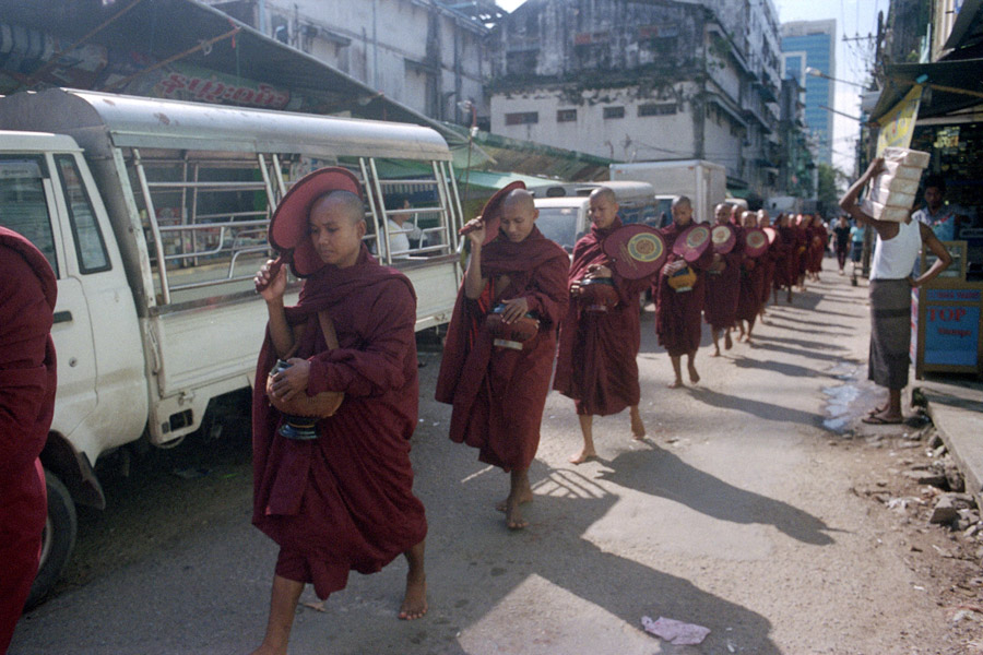Yangon 2013: morning alms in a busy city.
