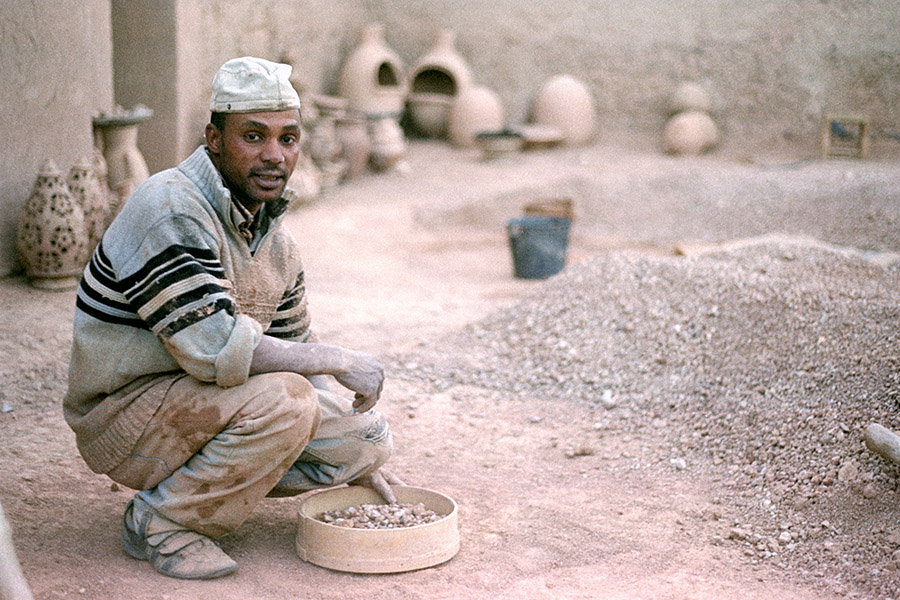 Skoura, Morocco 2017: Aziz reconstitutes clay from the stuff in his yard, throws pots on a wheel he has to manually turn, then bakes them in the wood-burning mud kiln that his father climbs inside to stack.