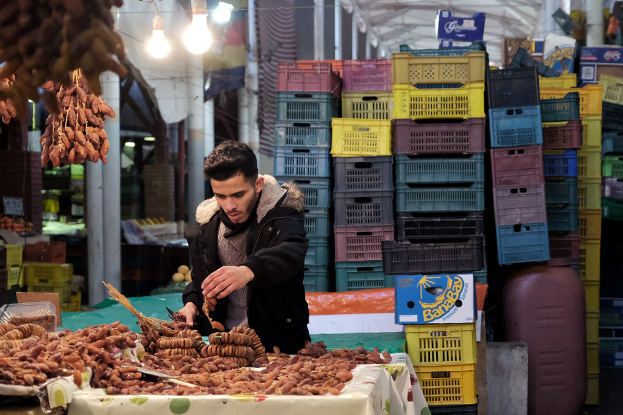 Tunis, Tunisia 2019: date vendor in the central market. Dates are one of Tunisia's main agricultural products.