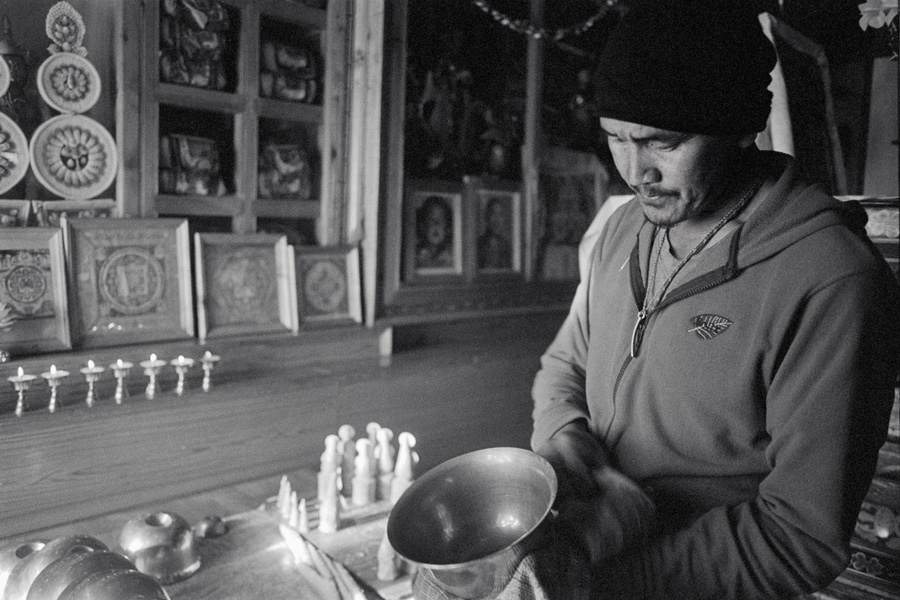 Ki Gompa, Spiti Valley, India 2014: Gunpo was extremely friendly and powered through our lack of shared language. He is one of the small group of lamas leading prayers, and prepares butter lamps and other religious items for the next day's ceremony. Spiti Valley is a remote, high-altitude slice of Tibet in India, mostly populated by subsistence farmers toiling under desert-like conditions. Ki Gompa is the most famous sight in a little-touristed location. Prayer halls in this region generally prohibit photos inside, but Gunpo allowed this one.
