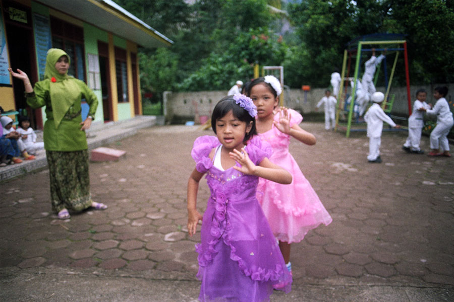 Harau Valley, Sumatra, Indonesia 2013: practicing for a recital. These girls apparently had special dispensation to take off their headscarves for the performance.