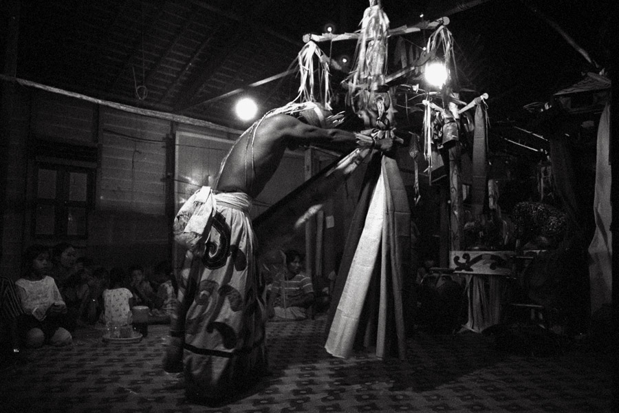 Tanjung Isuy, Kalimantan, Indonesia 2010: Tanjung Isuy is the first Dayak village at the start of the Mahakam River, and thus, less isolated. But the modern clothing, satellite TV and smartphones thinly disguise the traditional culture beneath. When a baby was ill, no Western medicine was used; rather, this doctor was called in for an 8-day dance ritual.