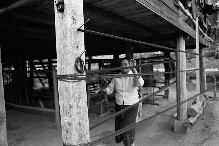 Sam Tai, Laos 2012: measuring the amount of thread needed for a sinh (sarong). Houaphan province and Sam Tai district in particular are famed in Laos for high-quality, intricate weavings.