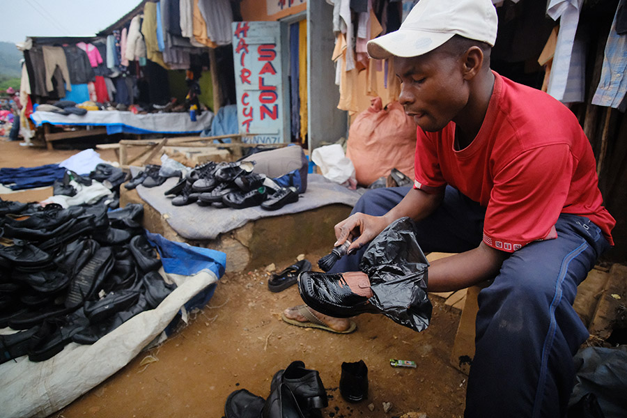 Lushoto, Tanzania 2018: students are required to wear black shoes to school, but as most people buy secondhand, the color isn't guaranteed. Prompting another innovative small business: painting the used shoes.