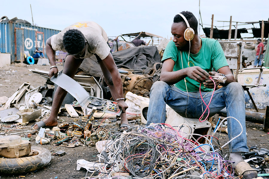 Accra, Ghana 2018: e-waste recyclers at the massive Agbogbloshie rubbish dump.